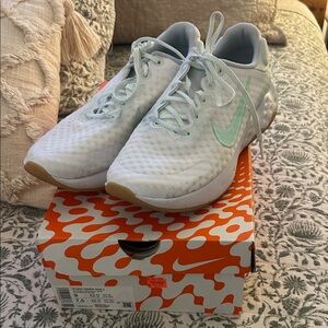 Nike Women's White and Mint Renew Ride 3 Sneakers